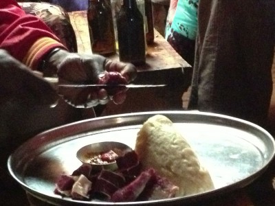 Tera Sega and a man with a big knife, Ethiopia, by Charlie Grosso